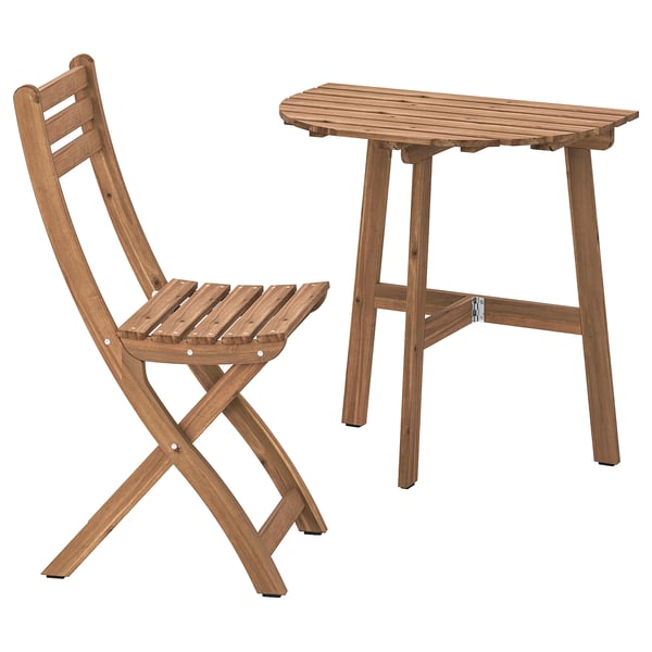 Askholm wooden outdoor set includes a light brown folding chair and a square table. Crafted from durable acacia wood, perfect for small spaces.