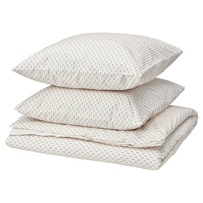 Three white pillows with beige dots, part of the BANDKNIPPE cotton set.