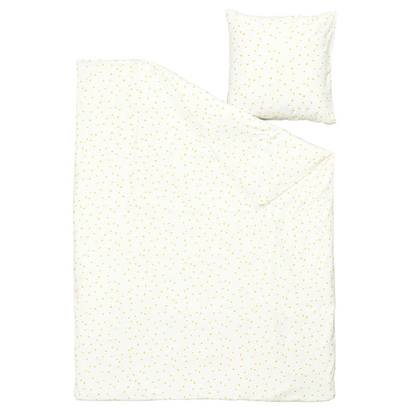 A white bedding set featuring tiny yellow dots, including a comforter and pillowcases, made of recycled cotton and viscose.