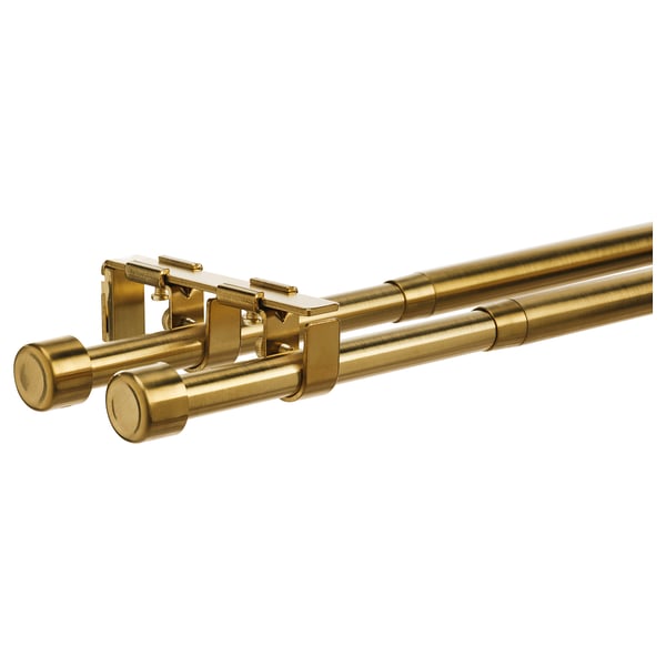 Gold curtain rod set with brackets and finials; elegant, adjustable, and complete for window decor.