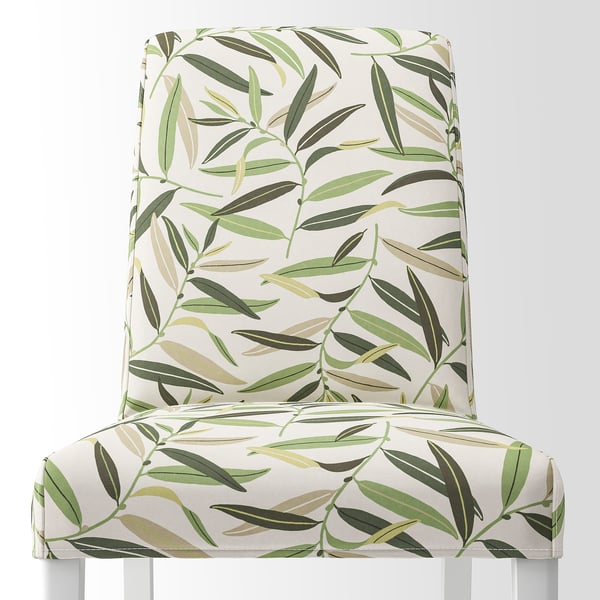 Floral chair with green leaf patterns, designed for comfort and style. Easy to clean.
