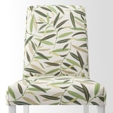 Floral chair with green leaf patterns, designed for comfort and style. Easy to clean.