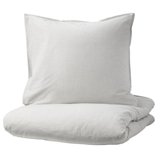 A BERGPALM duvet cover set. It light-colored stripes on soft cotton. The set includes a duvet cover and pillowcases with a vintage, handcrafted look.