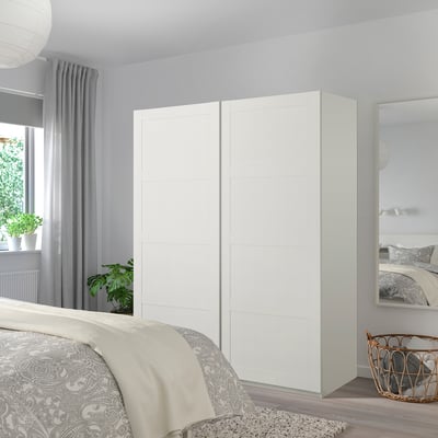 Modern white BERGSBO corner wardrobe, minimalist, larger than bed, mirrored.