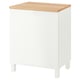 A white BESTÅ cabinet with a light oak top. It has clean lines and four white legs, offering both storage and a display surface.