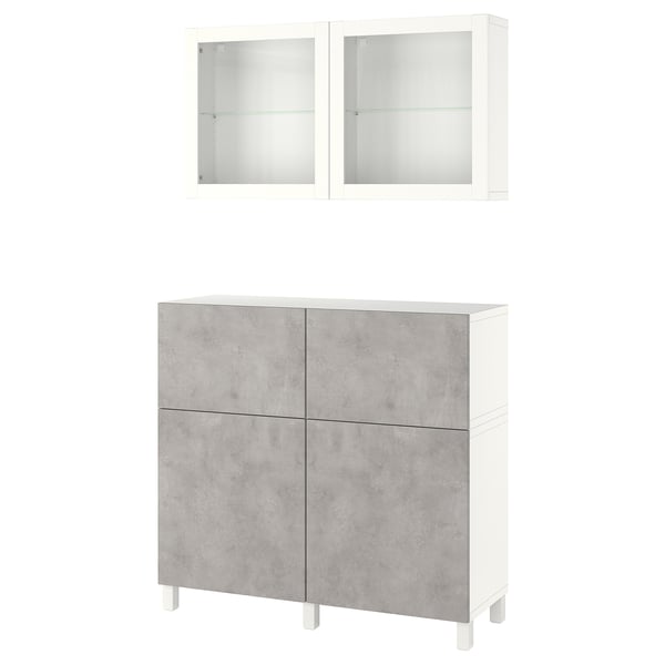 An ikea BESTÅ storage unit with concrete-effect grey doors and white wall cabinets. It includes shelves and drawers for versatile storage.