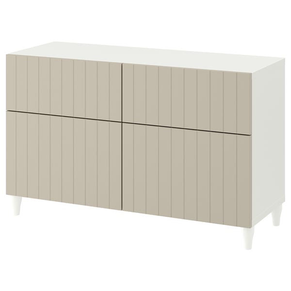 White BESTÅ sideboard with vertical panels, rectangular shape, four doors, and slightly tapered legs.