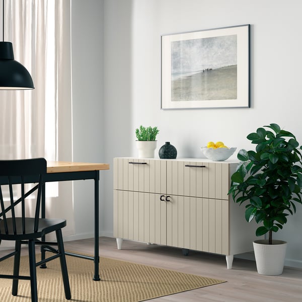 Modern dining: BESTÅ sideboard with fruits, plant, & art