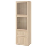 An ikea BESTÅ tall cabinet in white-brown, featuring glass doors at the top and drawers at the bottom, ideal for storage and display.