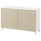 White-beige BESTÅ sideboard with two doors and white legs.