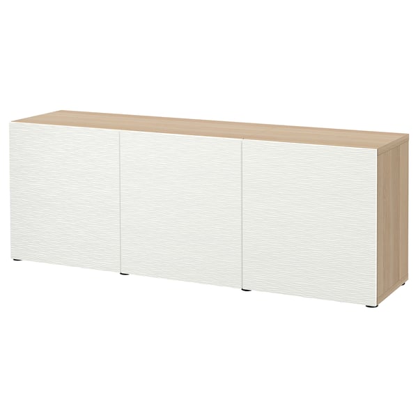 White BESTÅ storage sideboard with wooden top, three doors, adjustable shelves.