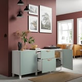 Modern storage cabinet with open doors, adjustable shelves, and decorative items on top.