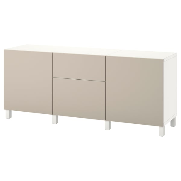 An ikea BESTÅ sideboard in beige and white. It two doors and two drawers with a minimalist design on white legs.