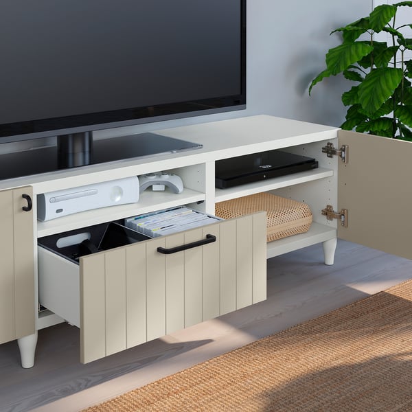 White BESTÅ tv bench with drawers. Holds media devices, remotes, and dvds. Soft-close drawers and cable management at the back.