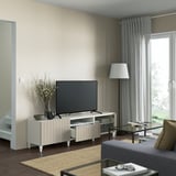 Modern living room with BESTÅ tv bench, flat-screen tv, and sleek decor. Soft closing drawers and cable management visible.