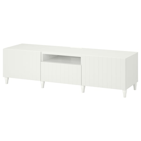 White BESTÅ tv bench, modern design, wooden legs, soft-closing drawers, clean lines, minimalist style.