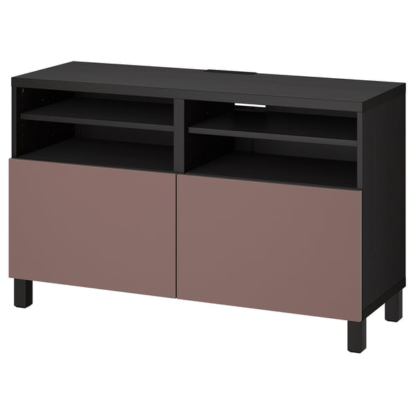 An IKEA BESTÅ tv stand in black and pink, featuring shelves and drawers for storage, with a sleek, modern design.