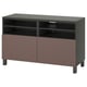An ikea BESTÅ tv bench in brown and black. It two doors, adjustable shelves, and cable management.