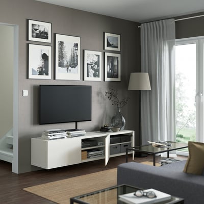 A white BESTÅ tv bench with three sections. Its sleek, rectangular, and designed for storage with adjustable shelves. Ideal for modern living spaces.