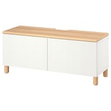 White BESTÅ tv bench with oak top, legs, and soft-close doors. Rectangular, minimalist design for cable management.