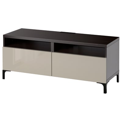 A black and beige BESTÅ tv unit with drawers and cable management. Modern design with metal legs.