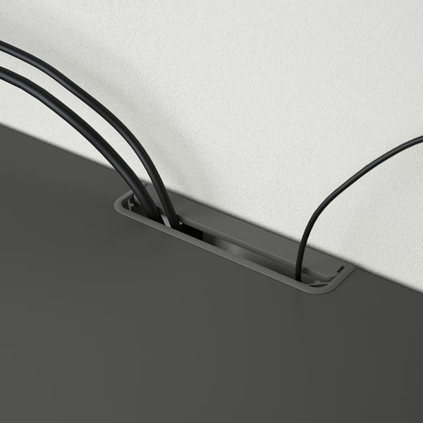 Cable management system on BESTÅ tv bench, hiding wires safely.