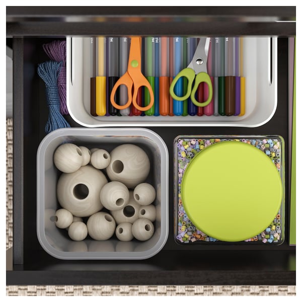 Craft supplies: top shelf with markers, scissors, strings, bottom left with wooden beads, right with colorful beads in green.