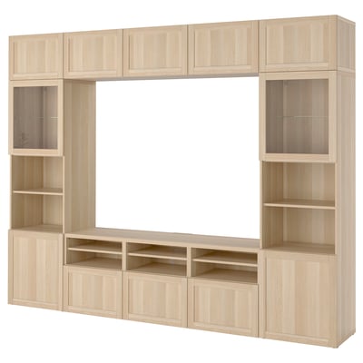 Light wood BESTÅ tv unit with shelves and cabinets for storage.