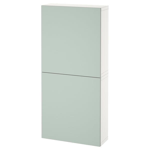 Ikea BESTÅ wall cabinet in light green with minimalist design for storage.