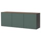 A green ikea BESTÅ sideboard with wood top. Its rectangular, large, with three closed cabinets for storage.