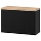 Modern BESTÅ storage unit. Black with wooden top. Rectangular, wall-mountable design.