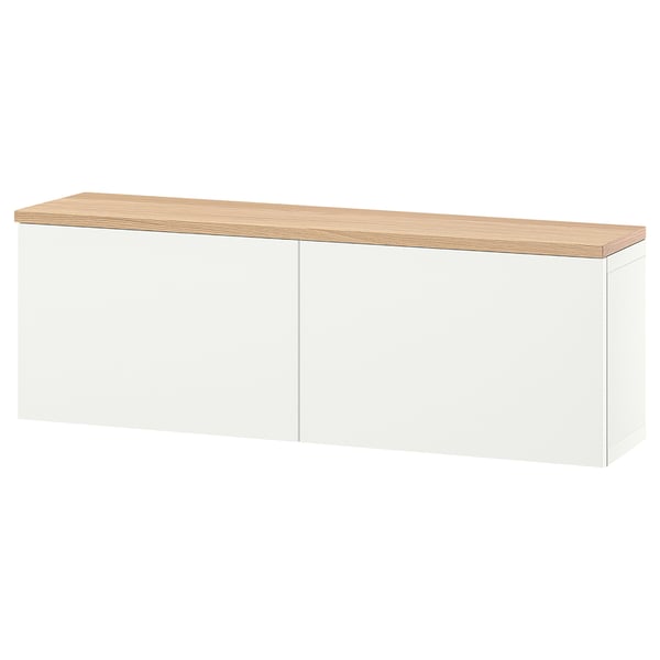A white BESTÅ storage unit with an oak top, featuring two closed sections. Modern, wall-mounted, with adjustable shelves inside.
