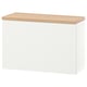 A BESTÅ storage unit, white with a wooden top, rectangular, and minimalist design.