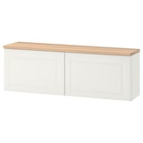 White BESTÅ storage unit with oak top, rectangular design, wall-mountable.