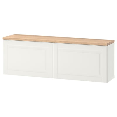 White BESTÅ storage unit with oak top, rectangular design, wall-mountable.