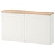 White BESTÅ storage cabinet, wooden top, rectangular, modern design.