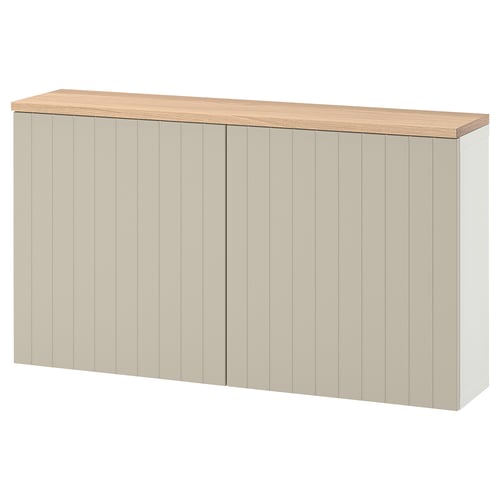 A beige ikea BESTÅ storage unit with oak top and push-open doors.