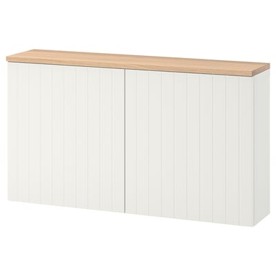 A white BESTÅ storage unit with a wooden top.