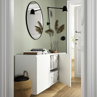 White BESTÅ wall-mounted cabinet offers storage and airy style.