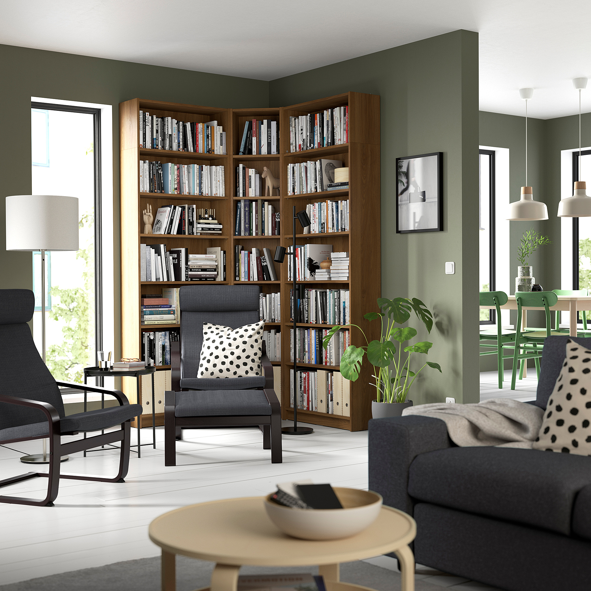 Spacious living room with BILLY bookcase, green walls, grey furniture, and large windows letting in natural light.