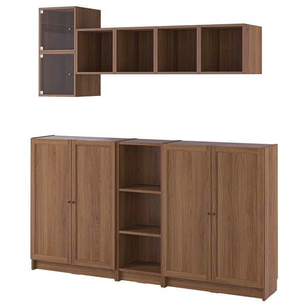 Wooden wall shelving unit and bookcases. Dark brown finish. Four doors, open center with shelves, and wall-mounted shelves.