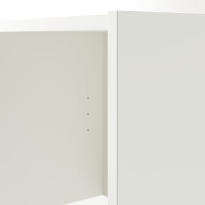 Minimalist white bookshelf with clean lines and no visible shelves.