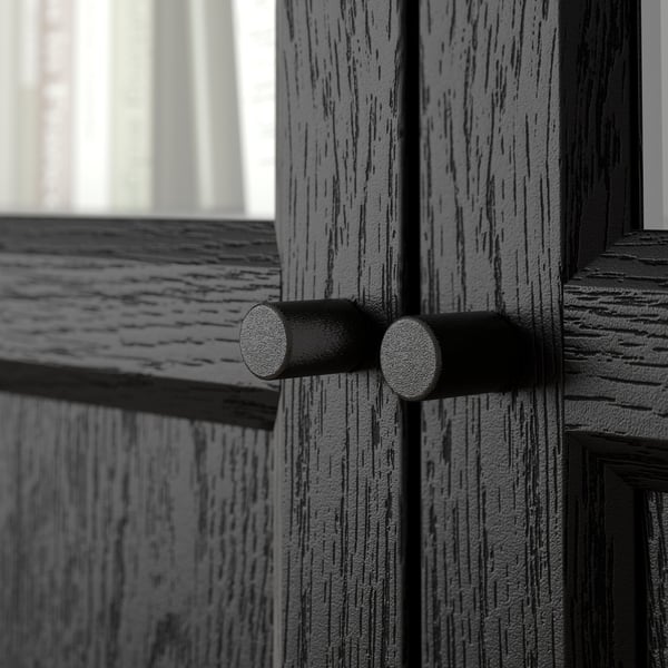 Close-up of dark BILLY bookcase hinge, showcasing sturdy construction and precise details.
