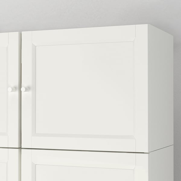 Clean, white BILLY bookcase. Sleek design with one closed door, minimalist style. High-quality painted finish, seamless edges.