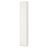 This image shows a white BILLY bookcase, a vertical storage unit with two adjustable shelves behind panel doors.