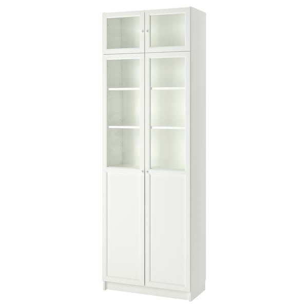 White BILLY bookcase with glass doors, tall and rectangular, has a modern design with adjustable shelves.