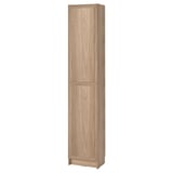 A tall, light brown BILLY bookcase with a single panel door, made from particleboard and fiberboard, featuring a simple and functional design.