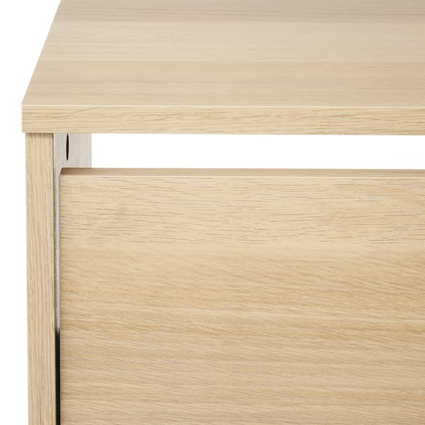 Shoe cabinet made of light wood with clean, smooth surfaces and precise edges. Shows high-quality craftsmanship and attention to detail.