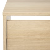 Shoe cabinet made of light wood with clean, smooth surfaces and precise edges. Shows high-quality craftsmanship and attention to detail.
