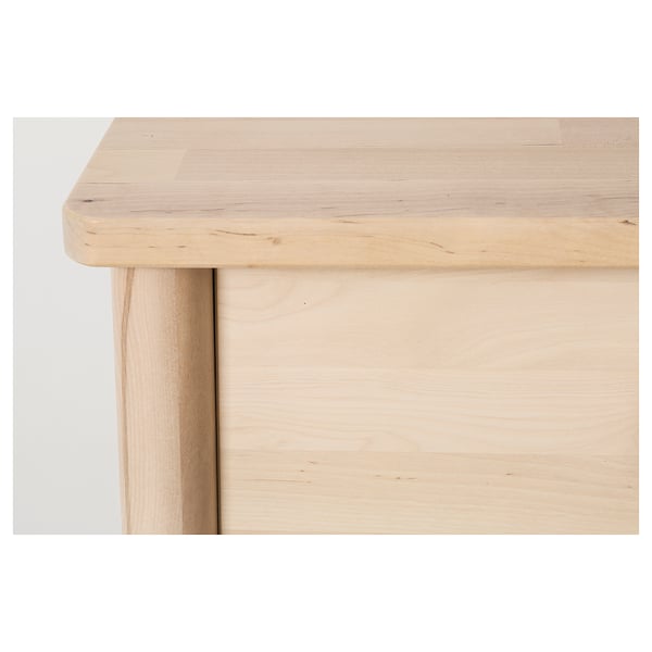 Smooth light wooden table leg; part of well-crafted furniture.